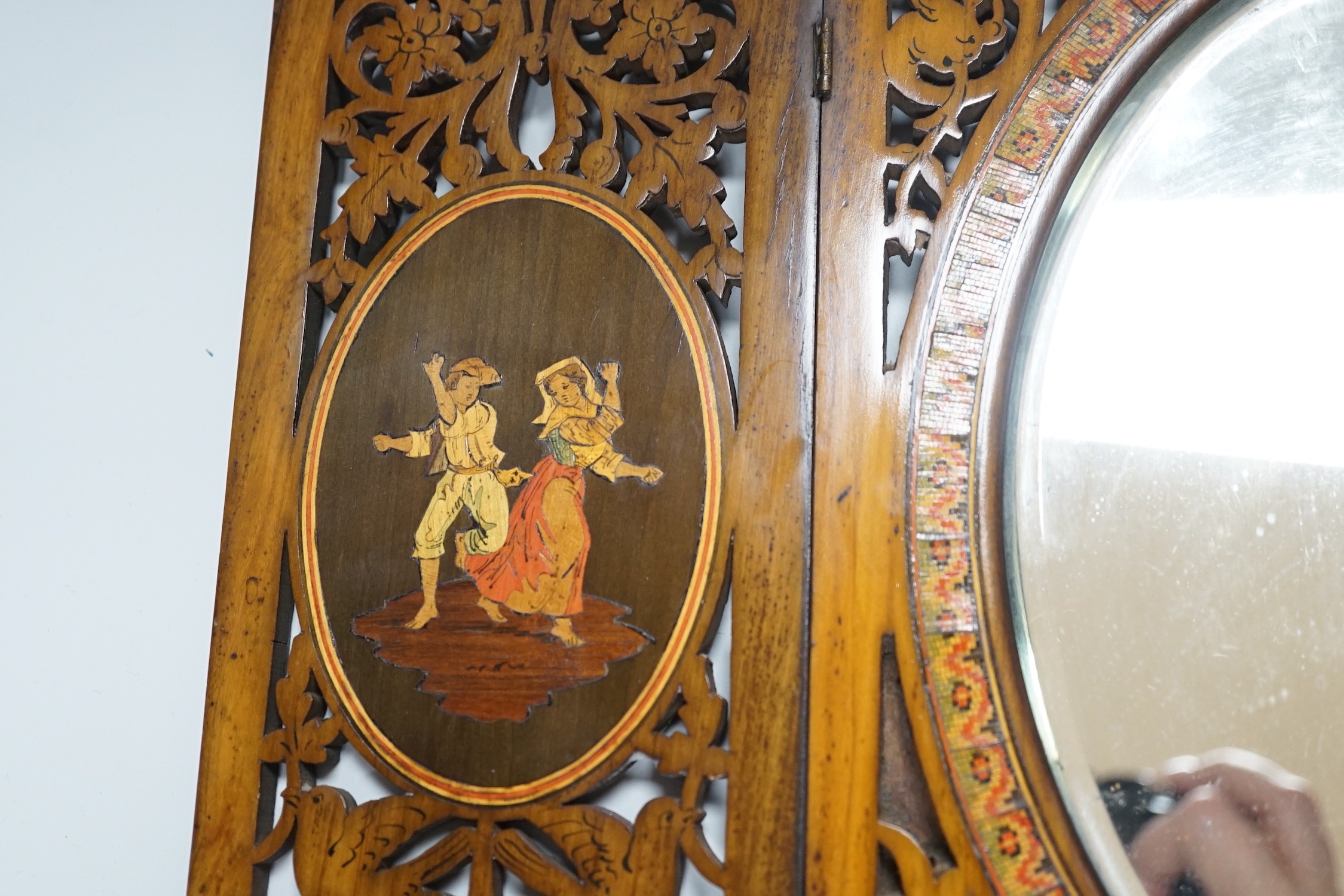 A 19th century fretted olivewood Sorrento ware toilet mirror, 45cm long